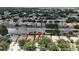 A high angle view features a home's backyard, complete with a canal for waterfront living in a residential community at 10449 Hunters Haven Blvd, Riverview, FL 33578