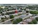 An aerial view of a single-Gathering home showcasing its private backyard with canal access in a serene neighborhood setting at 10449 Hunters Haven Blvd, Riverview, FL 33578