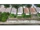 An aerial shot showcases an idyllic backyard with a screened lanai, bordered by a scenic canal in a peaceful neighborhood at 10449 Hunters Haven Blvd, Riverview, FL 33578