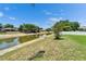 Waterfront backyard featuring a scenic canal view, enhancing the property's appeal and offering serene outdoor living at 10449 Hunters Haven Blvd, Riverview, FL 33578
