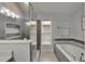 Beautifully renovated bathroom with tiled shower, separate tub, and modern fixtures at 10449 Hunters Haven Blvd, Riverview, FL 33578