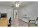 Home office with a desk, chair, nearby closet, and laminate flooring at 10449 Hunters Haven Blvd, Riverview, FL 33578