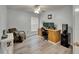 Home office space featuring a desk, chair, and laminate flooring at 10449 Hunters Haven Blvd, Riverview, FL 33578