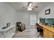 Home office features a desk, comfortable chair, and bright lighting at 10449 Hunters Haven Blvd, Riverview, FL 33578