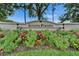 Landscaped South Pointe community sign with colorful flowers and lush greenery at 10449 Hunters Haven Blvd, Riverview, FL 33578