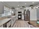 Bright kitchen with stainless steel appliances, updated cabinets, and stylish decor at 10449 Hunters Haven Blvd, Riverview, FL 33578