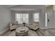 Cozy living room featuring neutral tones, comfortable seating, and bright natural light at 10449 Hunters Haven Blvd, Riverview, FL 33578