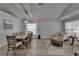 Open-concept living and dining area with hardwood floors and a bright, airy atmosphere at 10449 Hunters Haven Blvd, Riverview, FL 33578