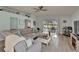 Bright living room with sliding glass doors to outdoor patio and view to back yard at 10449 Hunters Haven Blvd, Riverview, FL 33578