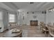 Bright, open-concept living and dining area with modern decor and plenty of natural light at 10449 Hunters Haven Blvd, Riverview, FL 33578