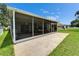Large screened-in patio overlooking the expansive backyard, perfect for year-round outdoor living and entertainment at 10449 Hunters Haven Blvd, Riverview, FL 33578