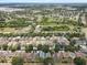 Panoramic aerial view of a residential area with several community ponds and mature trees at 11121 Running Pine Dr, Riverview, FL 33569