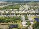 Aerial view of a residential neighborhood featuring community ponds and tree-lined streets at 11121 Running Pine Dr, Riverview, FL 33569