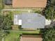 An aerial view of the home shows the roof, driveway, and surrounding neighborhood at 11121 Running Pine Dr, Riverview, FL 33569