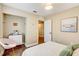 Comfortable bedroom featuring a soft color palette, modern dresser, and bright natural light at 11121 Running Pine Dr, Riverview, FL 33569