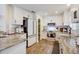 Modern kitchen with white cabinets, granite countertops, and stainless steel appliances at 11121 Running Pine Dr, Riverview, FL 33569