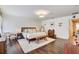 Bright main bedroom offers hardwood floors, neutral tones and ensuite bathroom at 11121 Running Pine Dr, Riverview, FL 33569