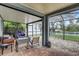 Relaxing screened-in patio with comfortable seating and a view of the backyard at 11121 Running Pine Dr, Riverview, FL 33569