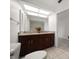Bathroom with granite countertop on vanity and bright lighting at 1142 Lancer Ln, Tarpon Springs, FL 34689