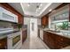 Kitchen area with tile backsplash, granite counters and stainless steel appliances at 1142 Lancer Ln, Tarpon Springs, FL 34689