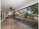 Screened lanai offering plenty of outdoor living space with access to the backyard at 1142 Lancer Ln, Tarpon Springs, FL 34689