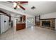 Open floor plan features kitchen, fireplace and sliding glass doors to the backyard at 1142 Lancer Ln, Tarpon Springs, FL 34689