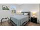 Comfortable bedroom with neutral decor, side tables with lamps, and natural lighting at 11635 Willmington Blvd, Port Charlotte, FL 33981