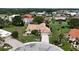 Aerial view of the cul-de-sac home featuring mature trees and beautifully landscaped grounds at 1201 Peridot Ln, Sun City Center, FL 33573