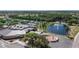 Aerial view of community center, water fountain, tennis courts, and clubhouse at 1201 Peridot Ln, Sun City Center, FL 33573
