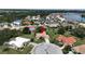 Aerial view of the property with lush landscaping and a red marker indicating its location at 1201 Peridot Ln, Sun City Center, FL 33573