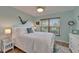 Charming bedroom with neutral color scheme and natural light at 1201 Peridot Ln, Sun City Center, FL 33573