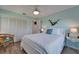 This bedroom features wood floors, white trim, and plentiful closet space at 1201 Peridot Ln, Sun City Center, FL 33573