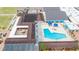 Aerial view of community pool and other community features, including lawn bowling at 1201 Peridot Ln, Sun City Center, FL 33573