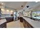 Modern kitchen features two-tone cabinets, stainless steel appliances, and ample counter space at 1201 Peridot Ln, Sun City Center, FL 33573