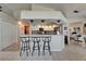 Modern kitchen featuring a breakfast bar with seating and updated appliances at 1201 Peridot Ln, Sun City Center, FL 33573