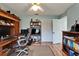 Functional office featuring hardwood floors, bright lighting, and closet at 1201 Peridot Ln, Sun City Center, FL 33573