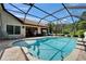 Inviting pool and patio area with ample seating for entertaining guests at 1201 Peridot Ln, Sun City Center, FL 33573