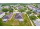 An aerial view shows the home's screened in back porch and neighborhood layout at 12202 Fairlawn Dr, Riverview, FL 33579