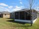 Exterior view of screened in back porch and fenced in yard at 12202 Fairlawn Dr, Riverview, FL 33579