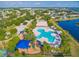 Aerial view showcasing community amenities, including pool, playground, and tennis courts at 12202 Fairlawn Dr, Riverview, FL 33579