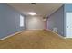 Spacious living room with neutral-colored walls, carpet flooring, a ceiling light, and a window for natural light at 12202 Fairlawn Dr, Riverview, FL 33579