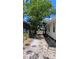 A view of the backyard, showing the side of the home and a partial view of the surroundings at 1221 E Osborne Ave, Tampa, FL 33603
