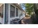 View of the home's exterior, highlighting the siding and window placement at 1221 E Osborne Ave, Tampa, FL 33603