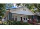 Quaint single-story home featuring a covered front porch and classic architectural details at 1221 E Osborne Ave, Tampa, FL 33603