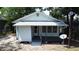 Charming house with a welcoming porch, perfect for enjoying the outdoors and adding character at 1221 E Osborne Ave, Tampa, FL 33603