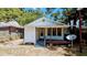 Features a cozy covered porch, offering a relaxing outdoor space and curb appeal at 1221 E Osborne Ave, Tampa, FL 33603