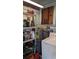 Utility Room with a water heater, washer and dryer hookups, and shelving at 1221 E Osborne Ave, Tampa, FL 33603