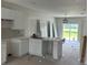 New kitchen build with white cabinets, marble countertops, and new appliances at 12223 Kirk Ave, Port Charlotte, FL 33981