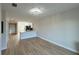 Open-concept living room showcasing new floors and plenty of natural light at 12223 Kirk Ave, Port Charlotte, FL 33981