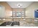 Close up on a kitchen sink and granite countertops at 1226 Baycrest Dr, Wesley Chapel, FL 33543